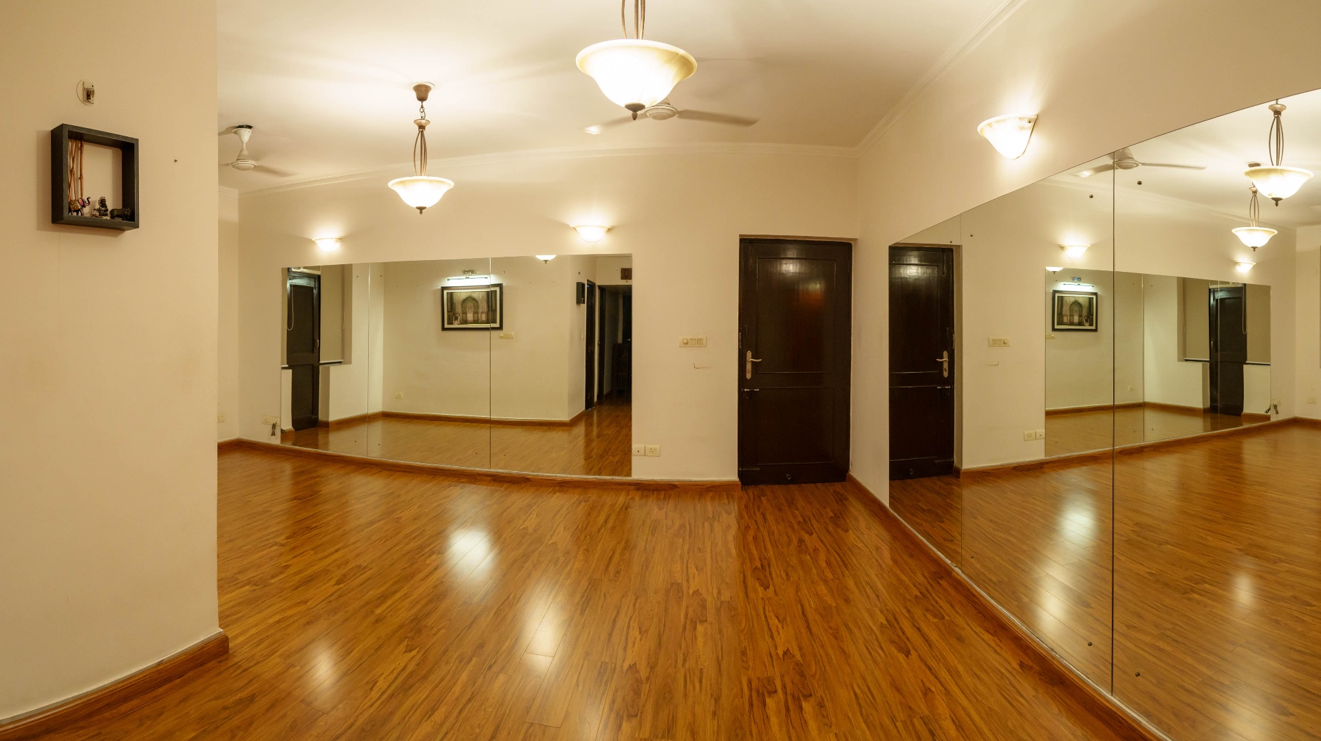 Wide view of the mirrored studio entrance